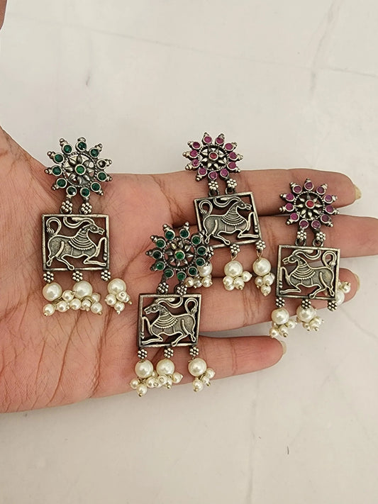 Poorvi silver alike earrings