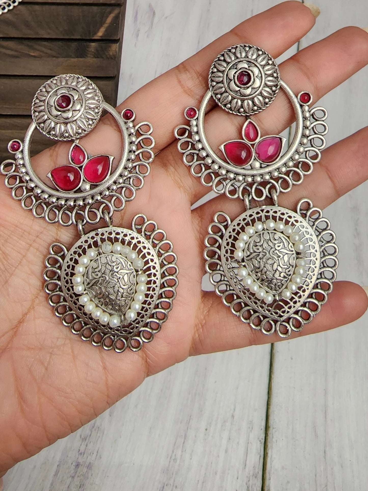 Poorvi silver alike earrings